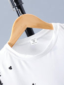 Conjunto de camiseta negra de manga corta con estampado de espadas y pantalones cortos para adolescente