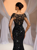 Vestido Preto em Renda – Costas Abertas, Manga Longa e Bordado Floral