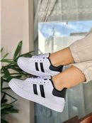 Zapatillas deportivas de rayas para mujer adulta